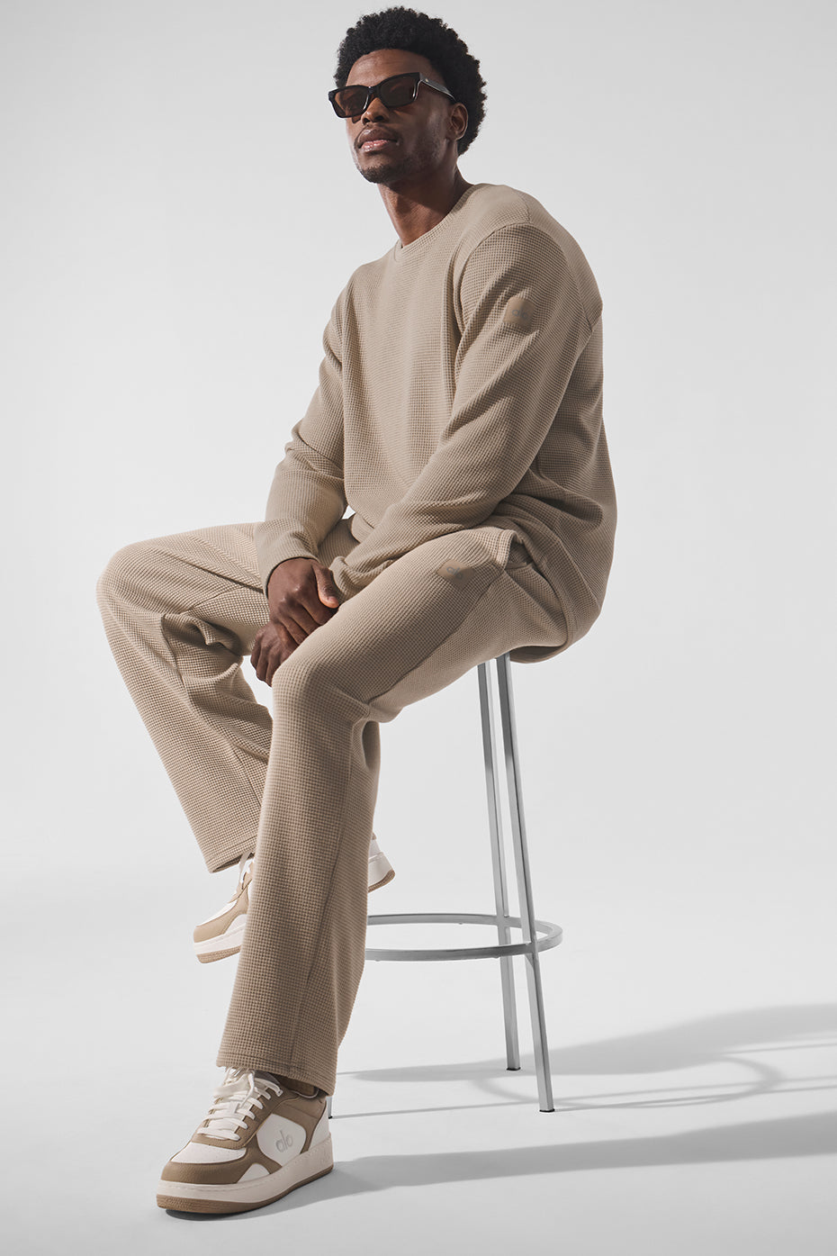 Stylish Elevate Waffle Long Sleeve Crewneck Shirt in Gravel, worn casually.