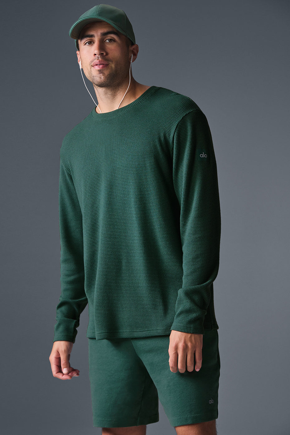 Front angle of white long sleeve shirt in waffle crewneck style.