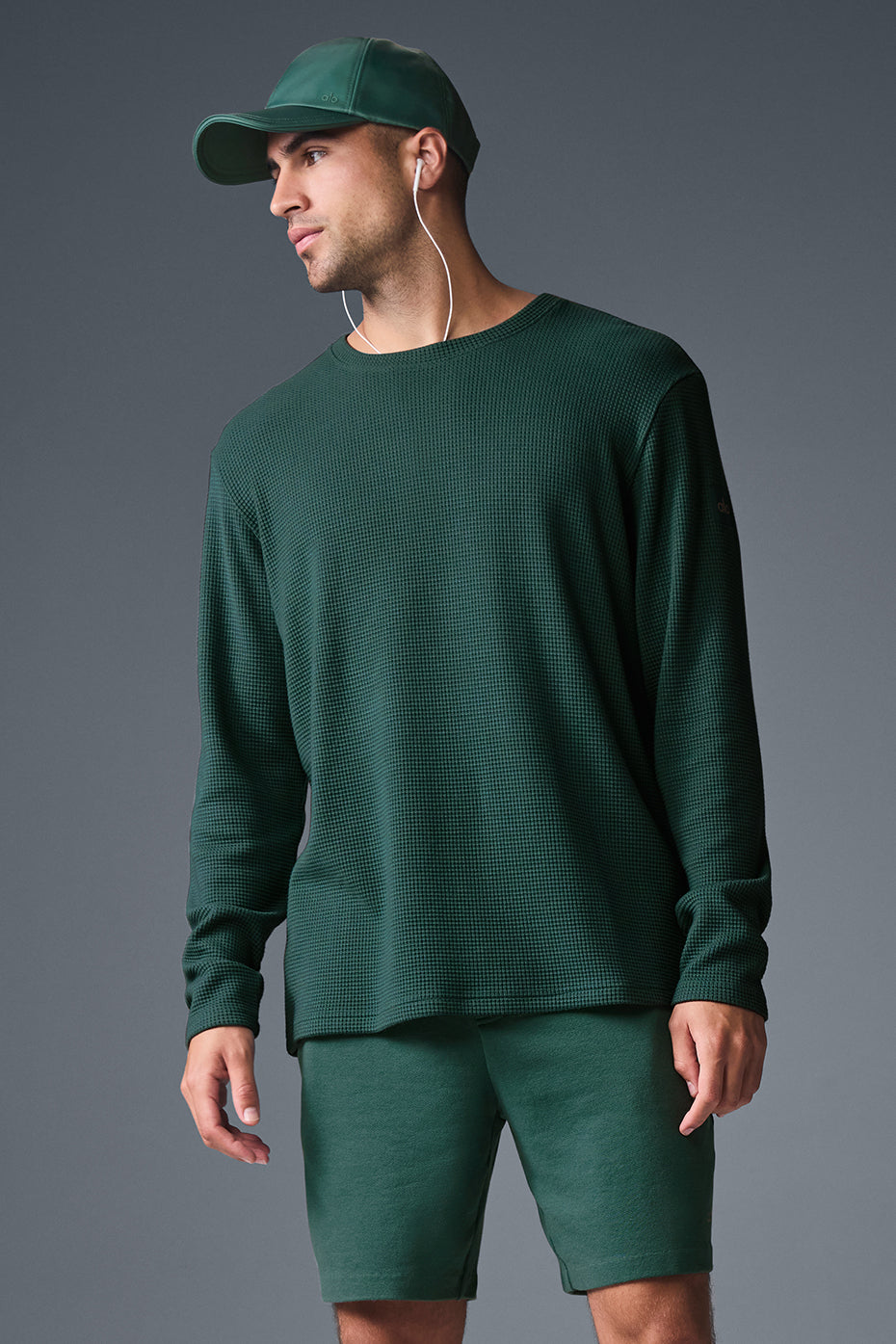 Front angle of white long sleeve shirt in waffle crewneck style.