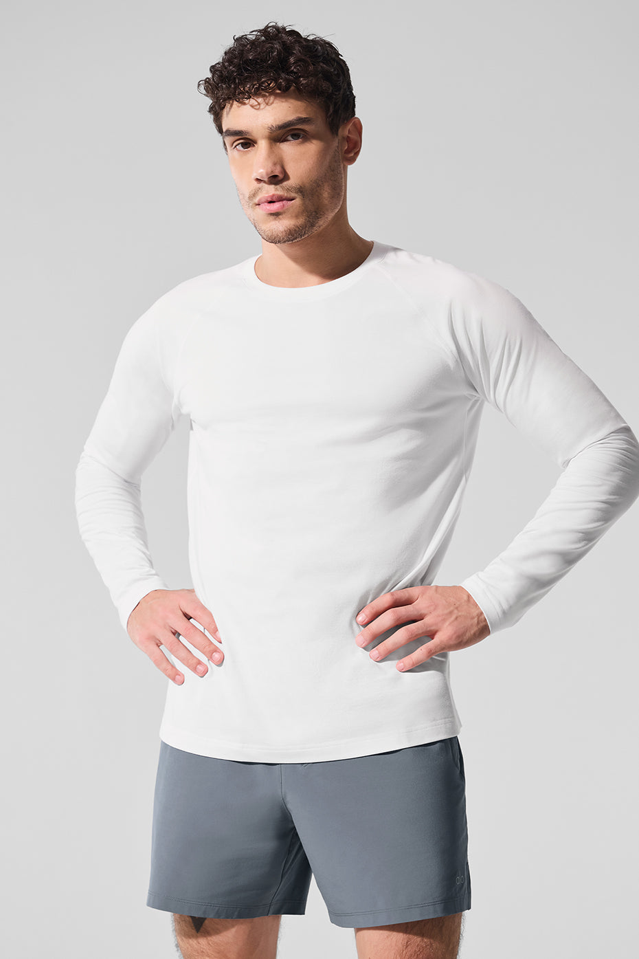 Front view of the white long sleeve shirt perfect for activewear