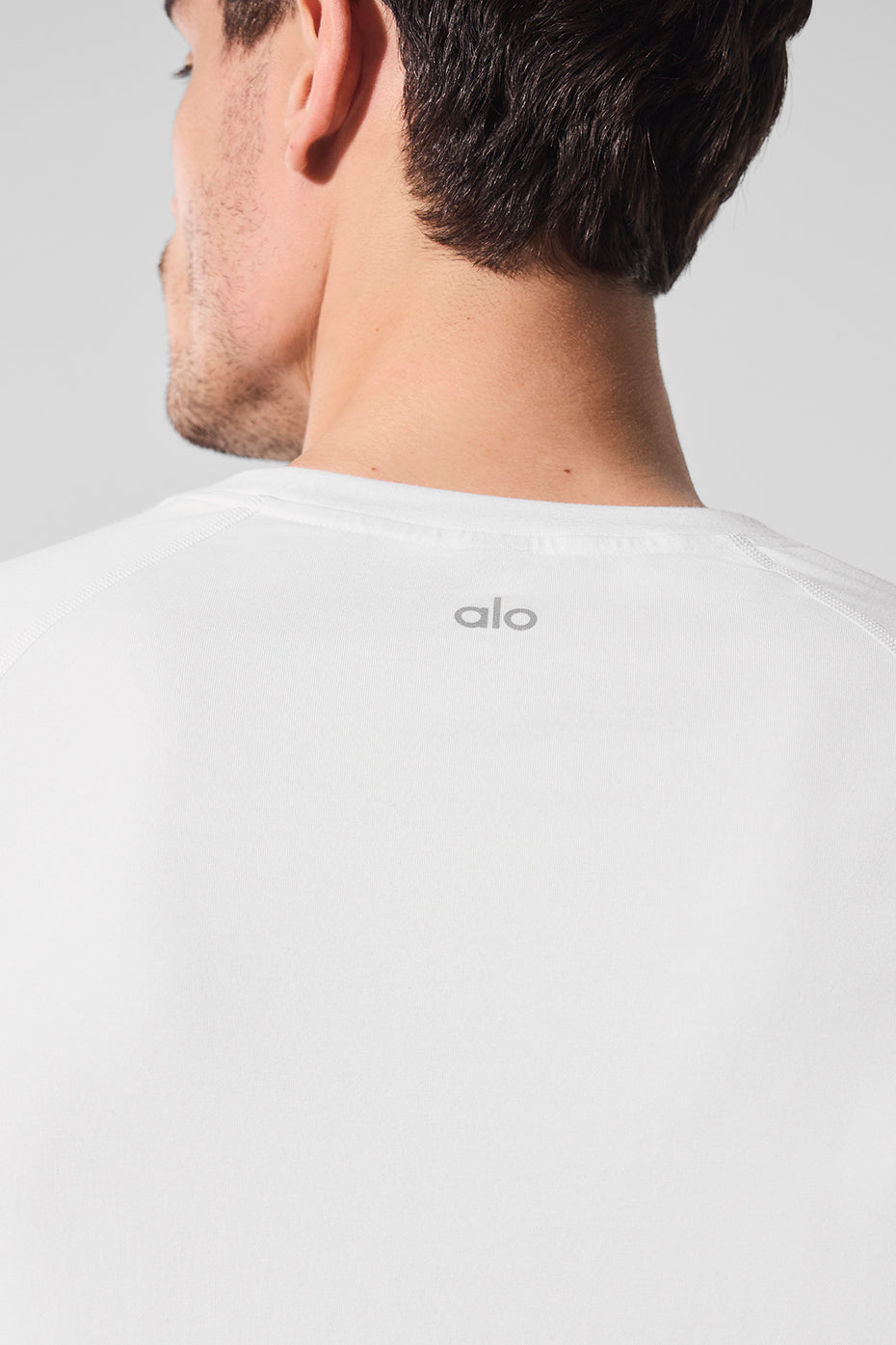 Front view of the white long sleeve shirt perfect for activewear