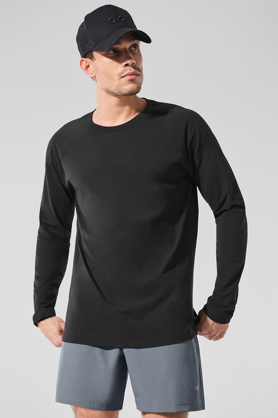 Black long sleeve workout top shown from the front, perfect for performance activities.