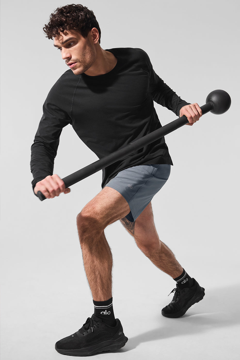 Black long sleeve workout top shown from the front, perfect for performance activities.