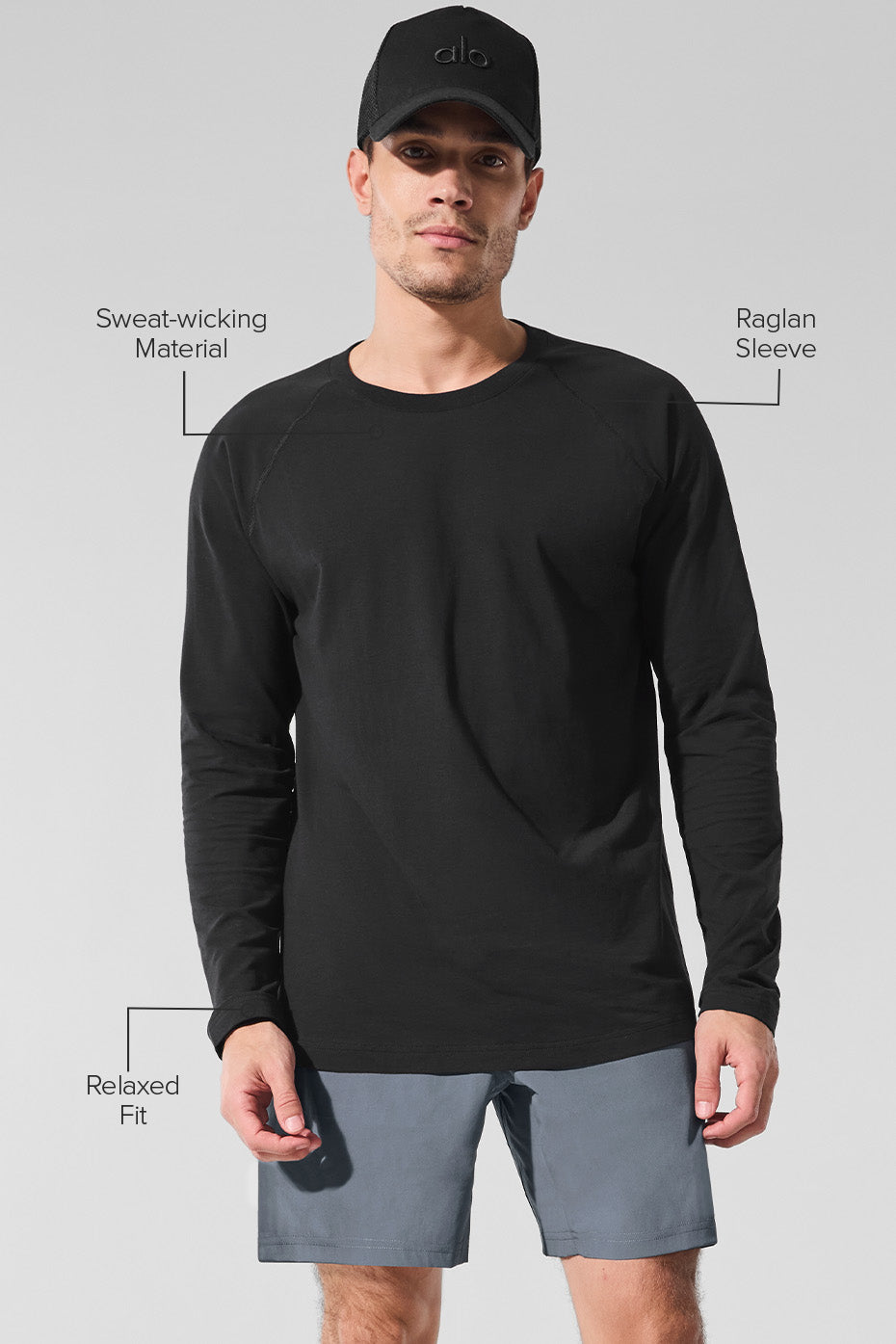 Model in a cropped long sleeve workout top during a fitness training session.