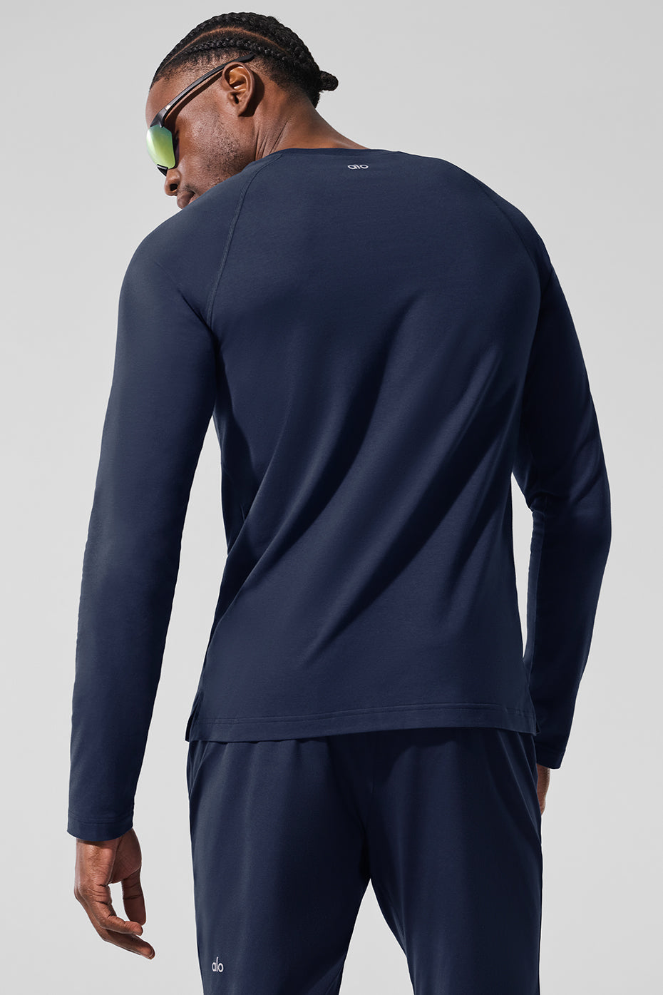 Back view of the ALO Vapor Long Sleeve Shirt in Navy, highlighting its stylish cut.