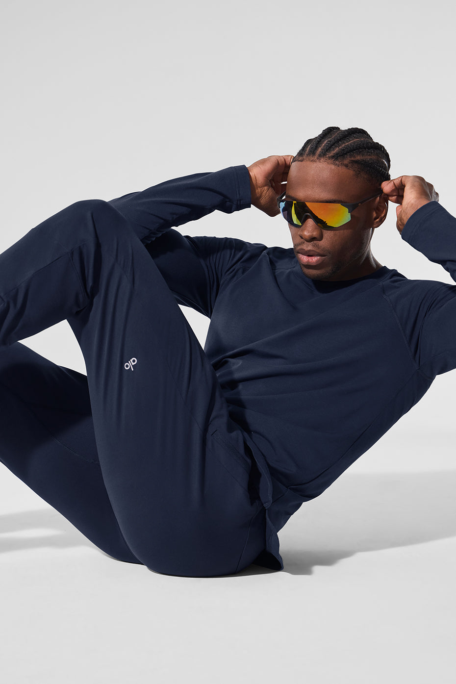 Side view showcasing the fitted design of the ALO Vapor Long Sleeve Shirt.