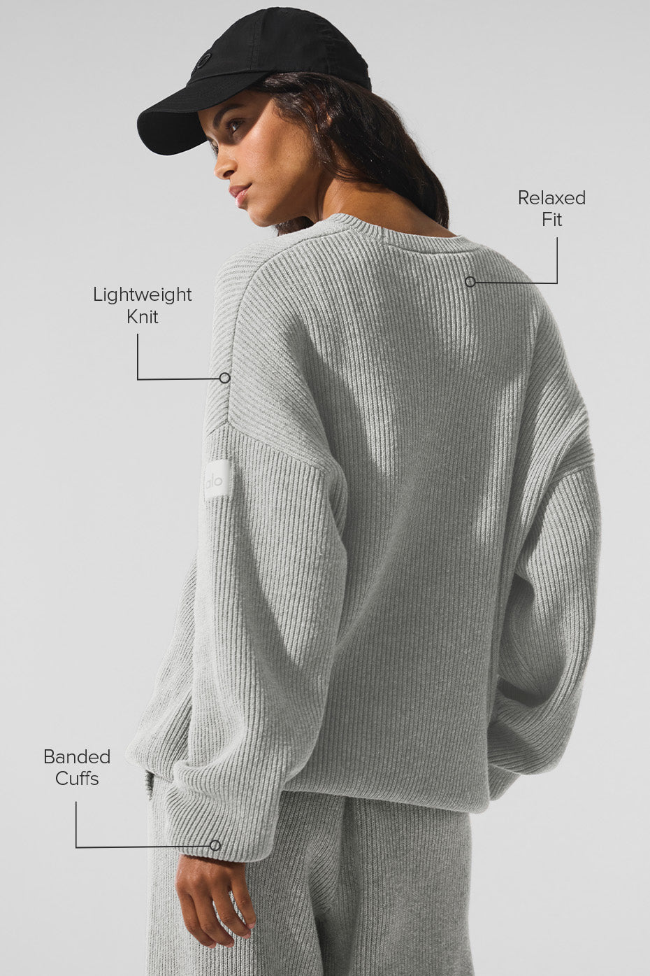 Model wearing the athletic grey crew neck sweater with jeans, perfect for a casual outing.