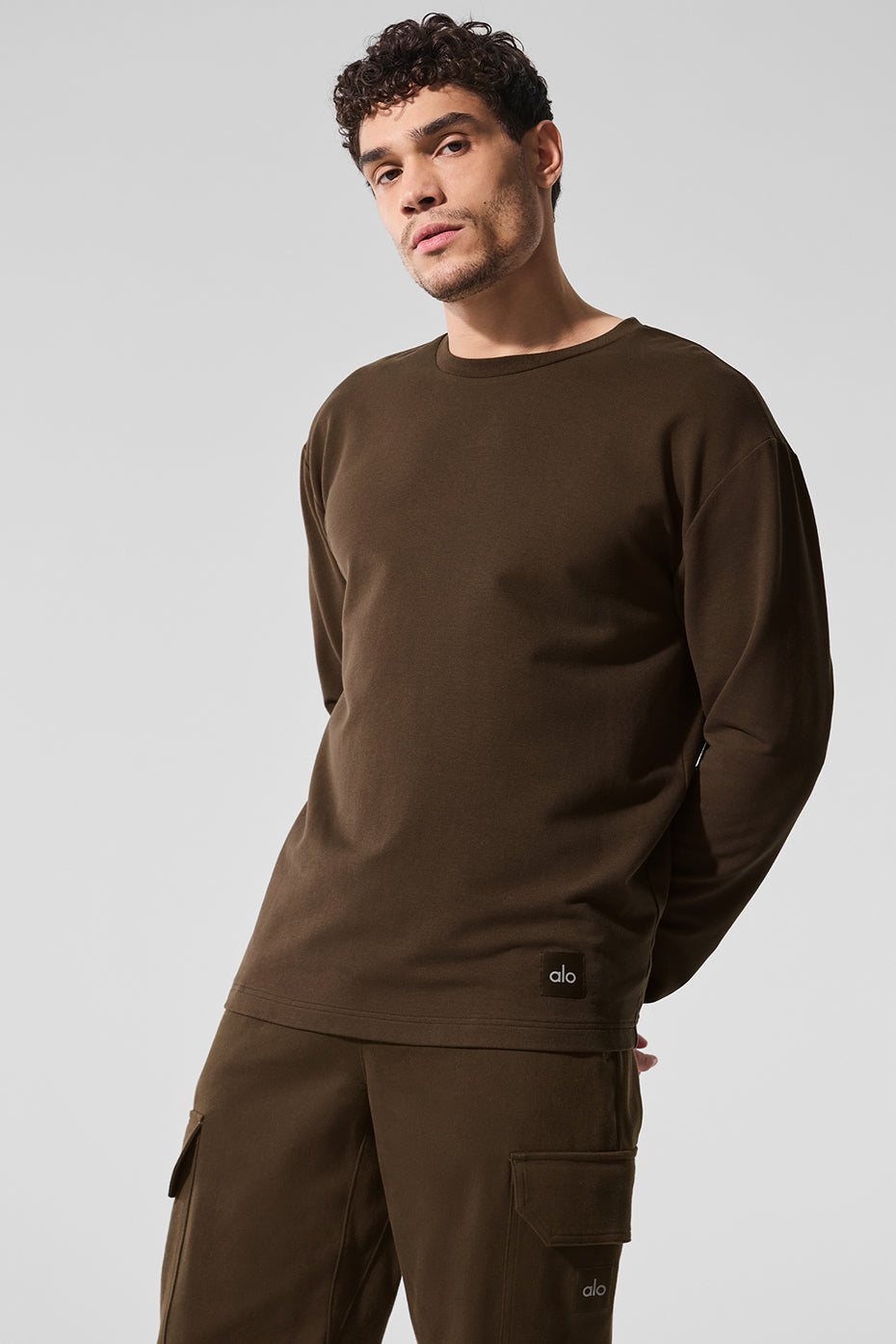 Close-up of the espresso long sleeve crew top, highlighting the fabric texture.