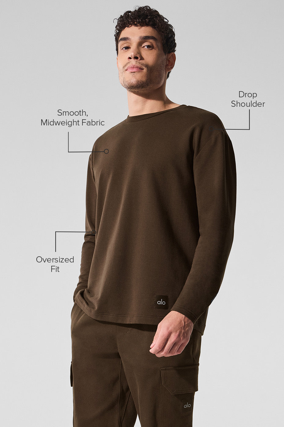 Model styled in the long sleeve crew top, perfect for a casual outing.