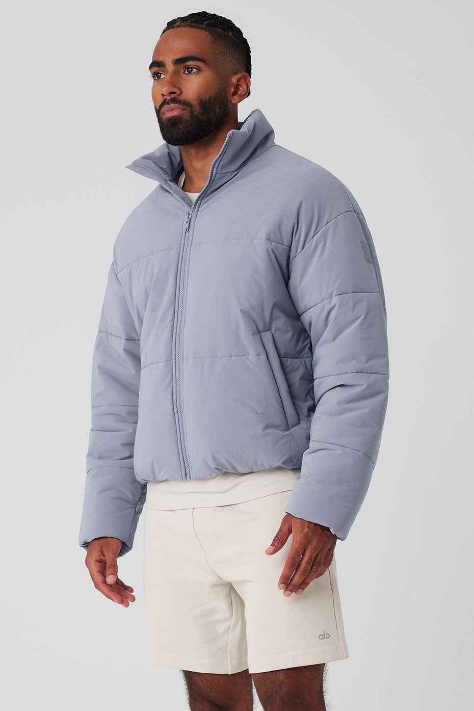 Side view of the mens puffer jacket highlighting its fitted, street-ready design