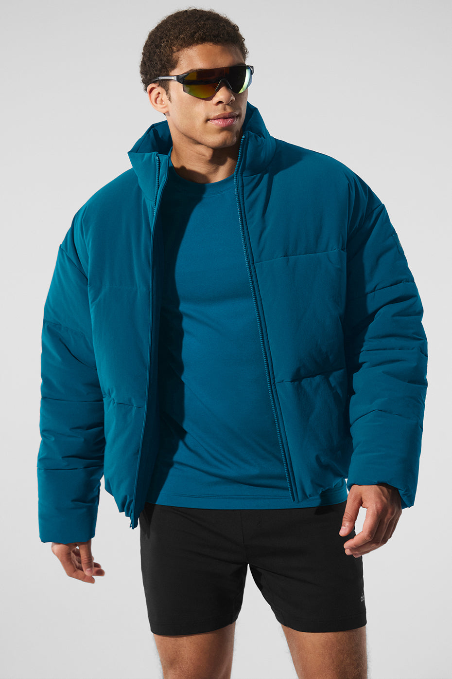 Front view of the mens lightweight jacket in Eclipse Blue, styled with urban streetwear accessories