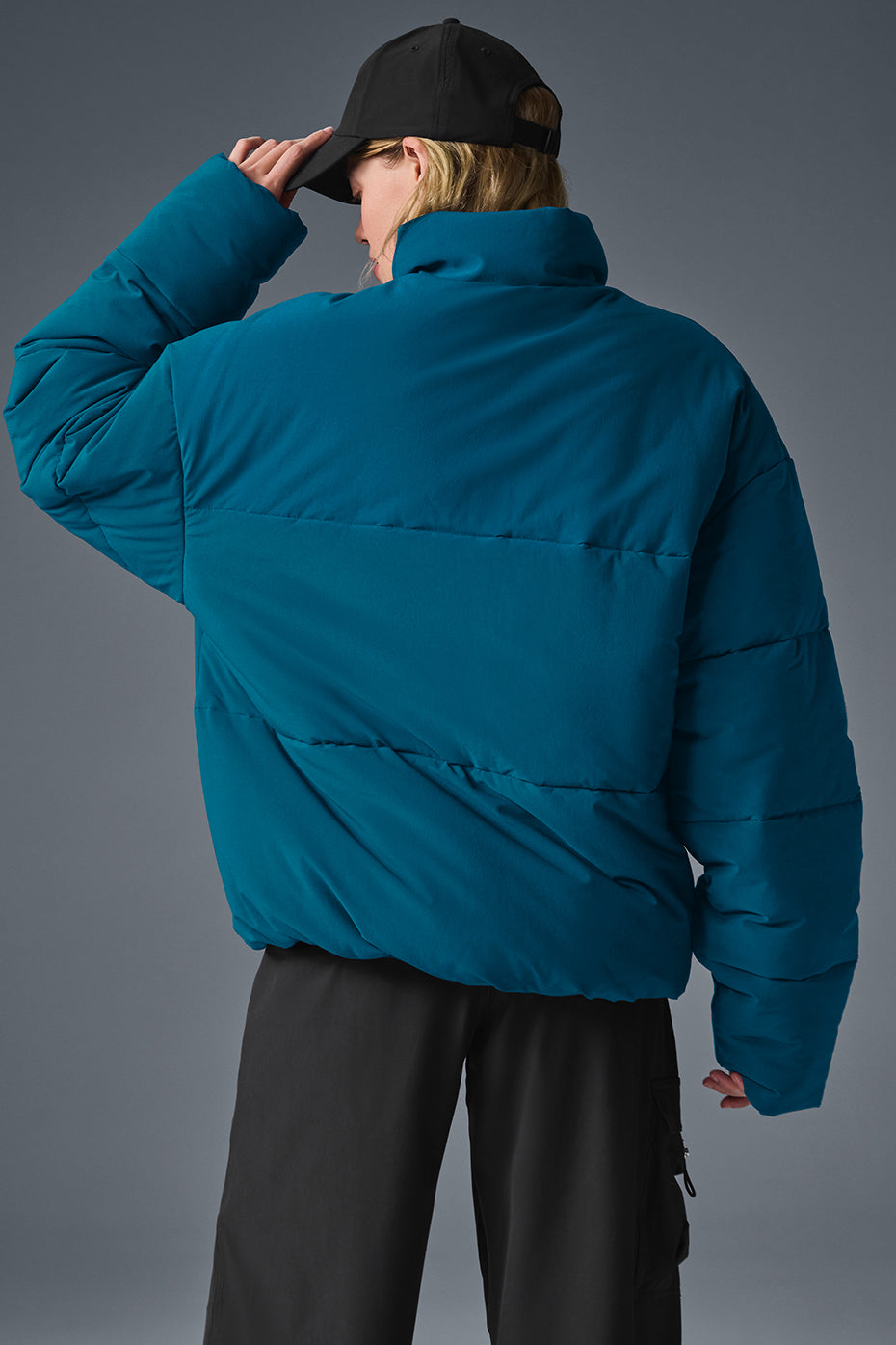 Side view of the lightweight urban puffer jacket with plush filling and stylish design