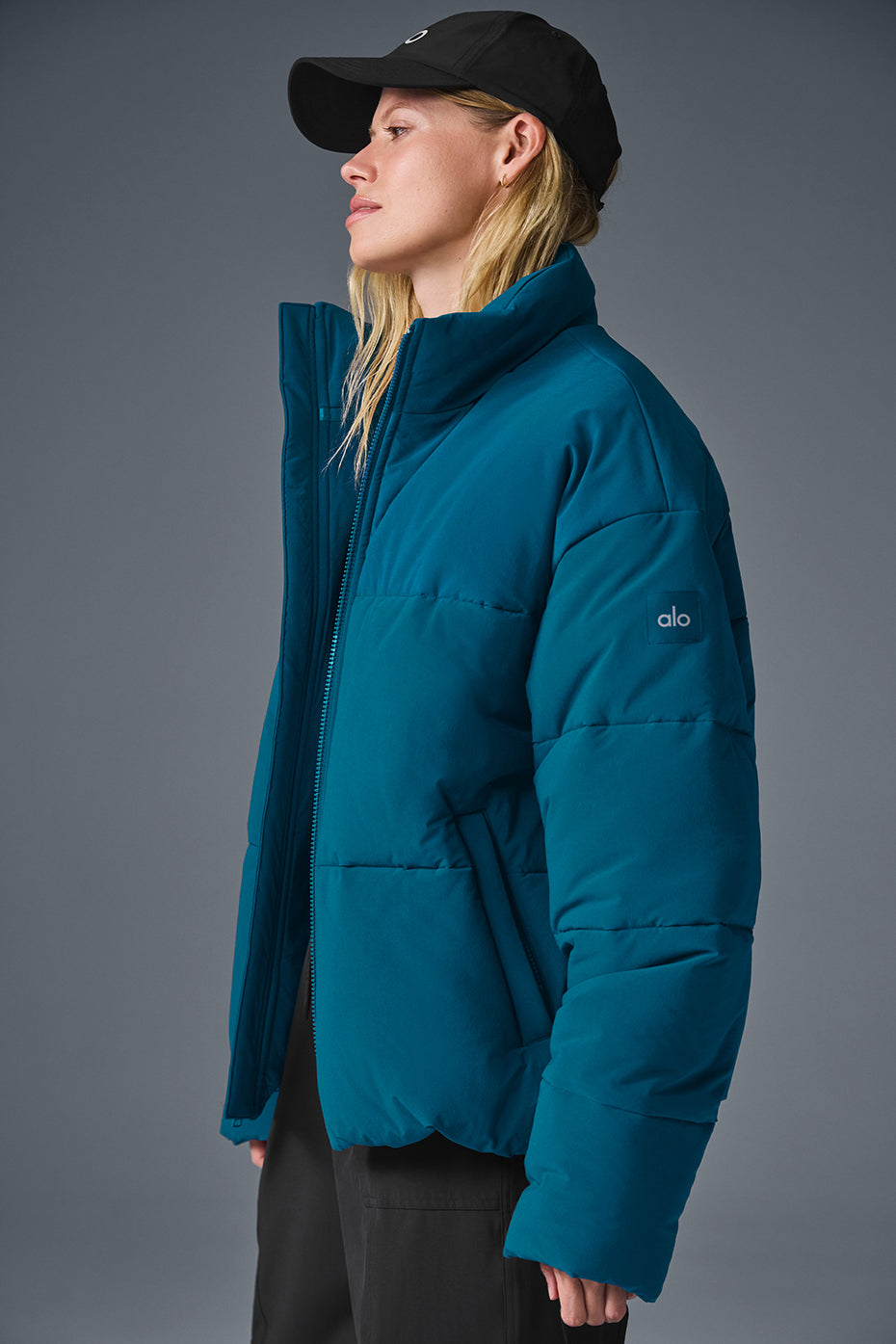 Close-up of the softly lined pocket and stand-up collar detail on the mens streetwear jacket