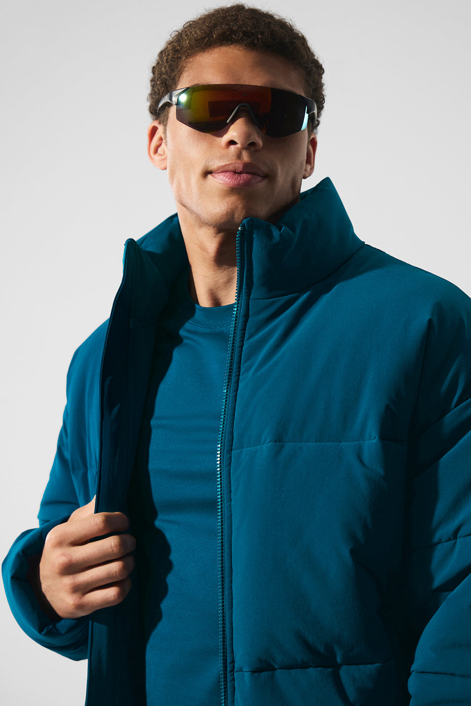 Front view of the mens lightweight jacket in Eclipse Blue, styled with urban streetwear accessories