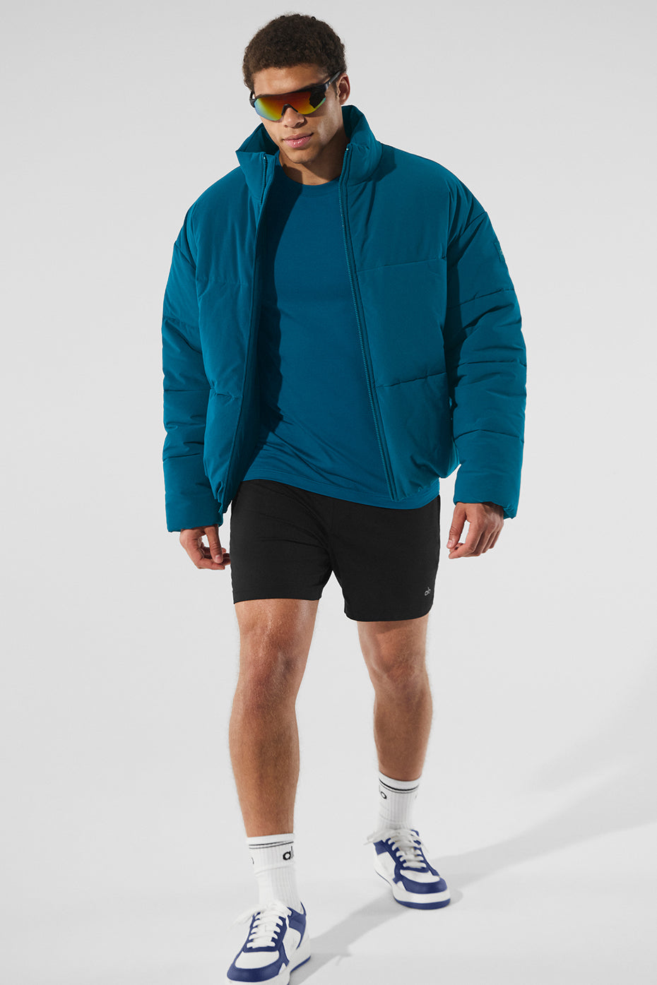 Side profile of the lightweight down jacket highlighting its slim fit and cozy material