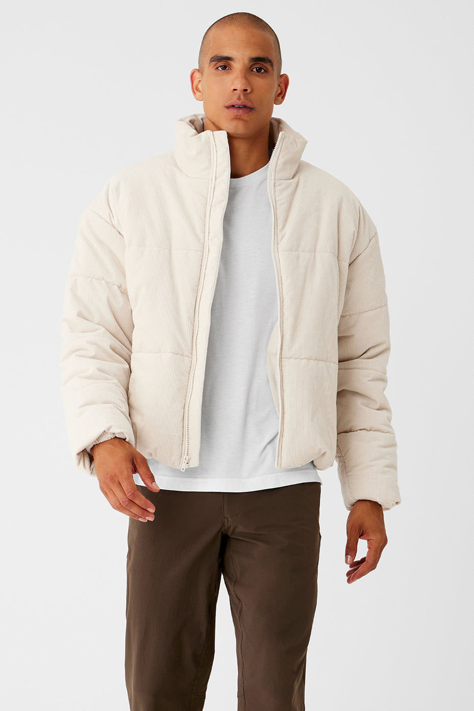 Close-up of corduroy texture and stitching on puffer jacket