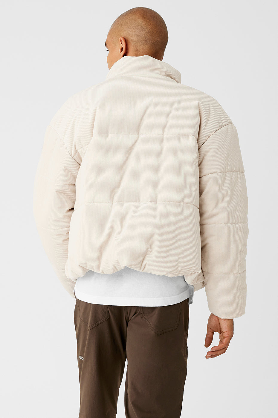 Model showcasing the jackets slightly oversized fit in urban setting