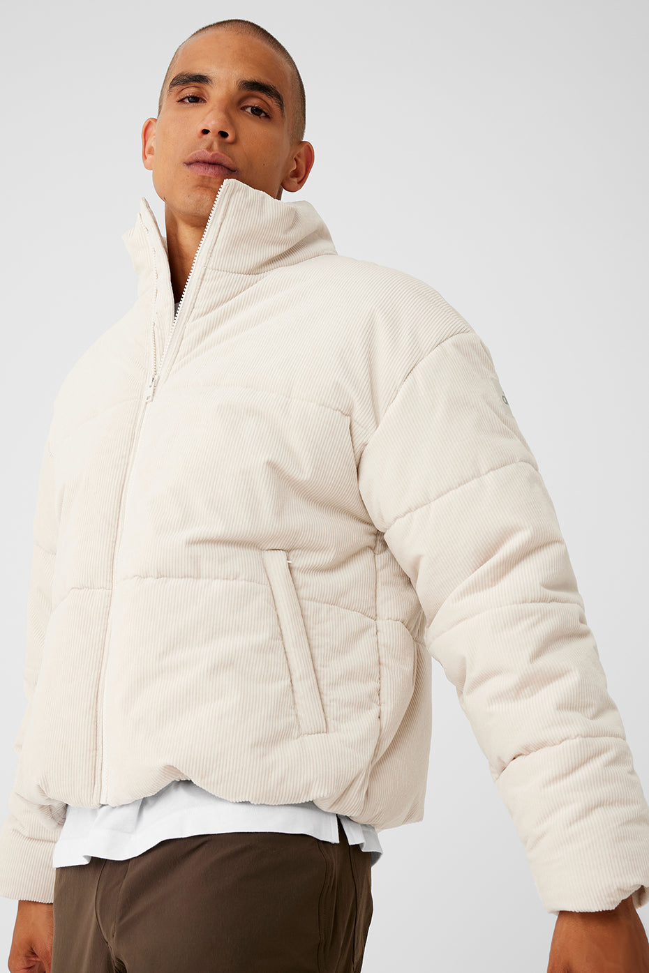 Model showcasing the jackets slightly oversized fit in urban setting