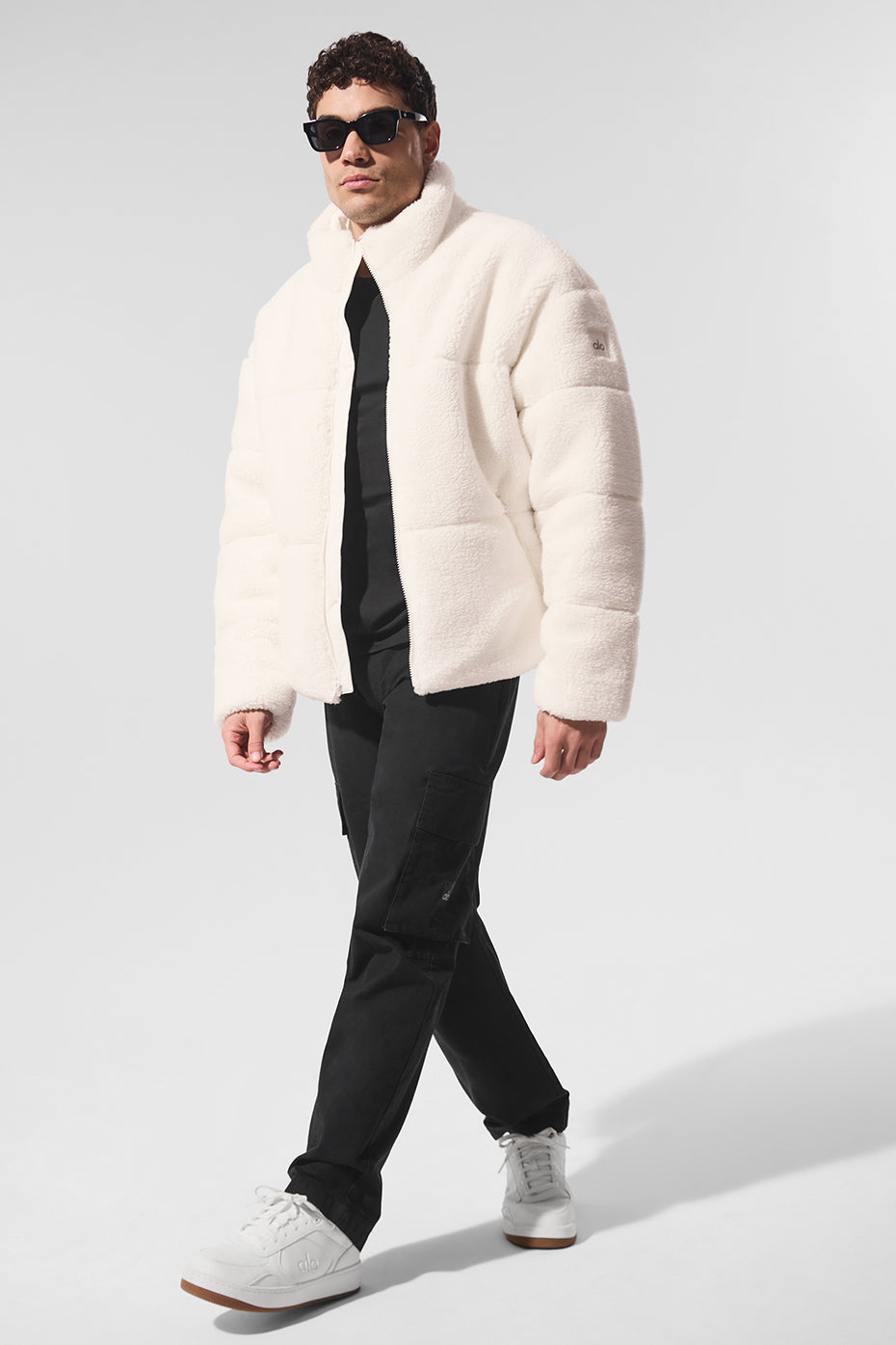 Front view of ivory sherpa puffer jacket showcasing its cozy design.