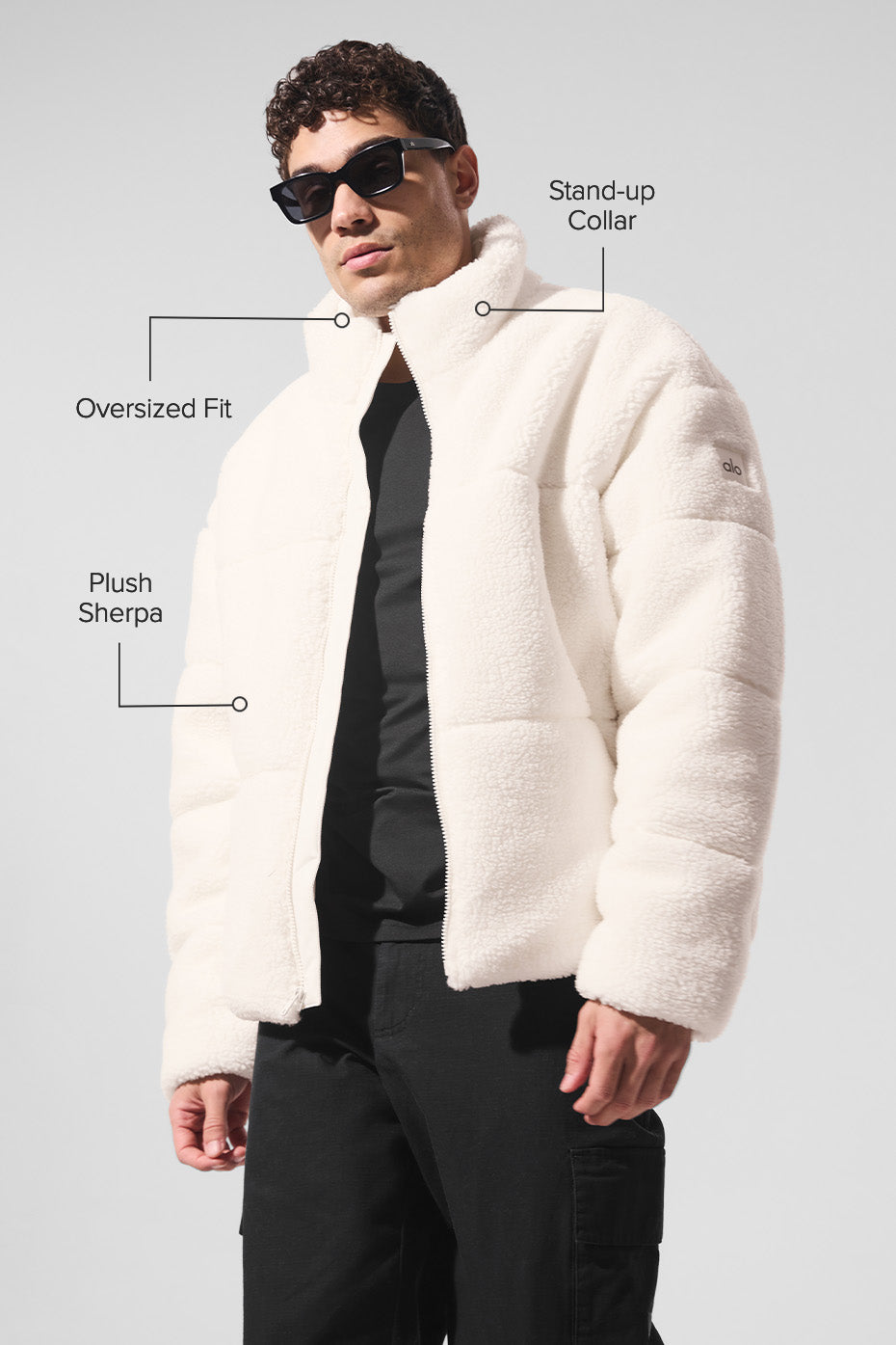 Side view of the warm ivory puffer jacket with zippered pockets.