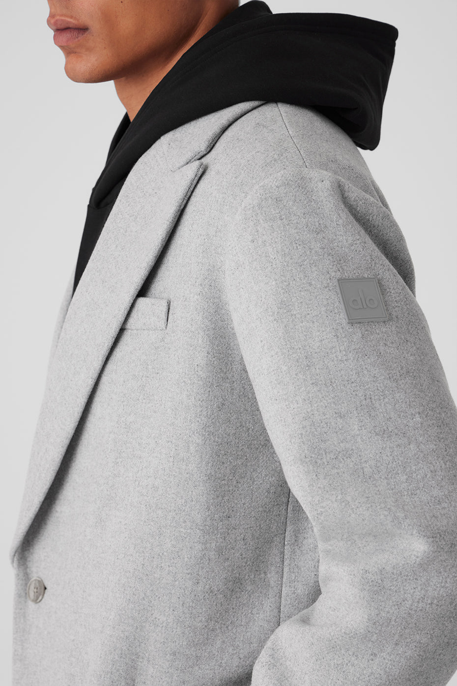 Front view of Gameday overcoat highlighting notched lapels and button closure.