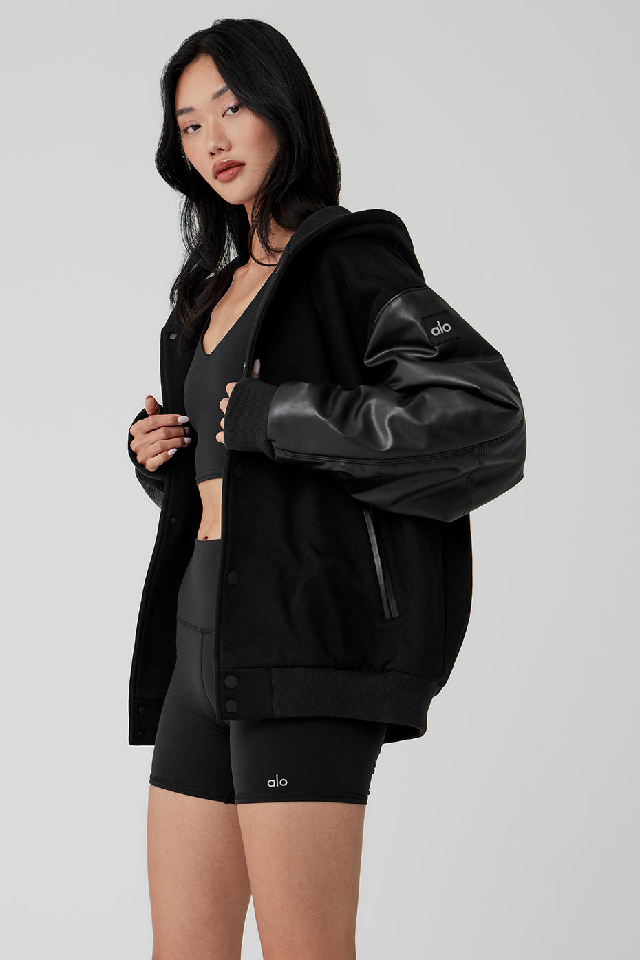 Urban outfit featuring a black bomber jacket for women.