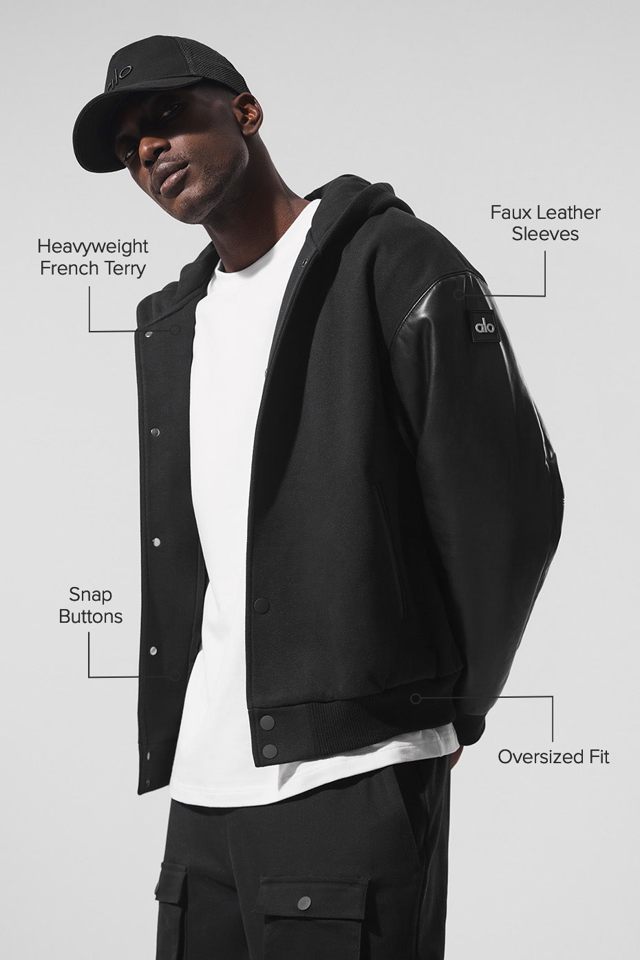 Side profile showing faux leather sleeves and ribbed cuffs