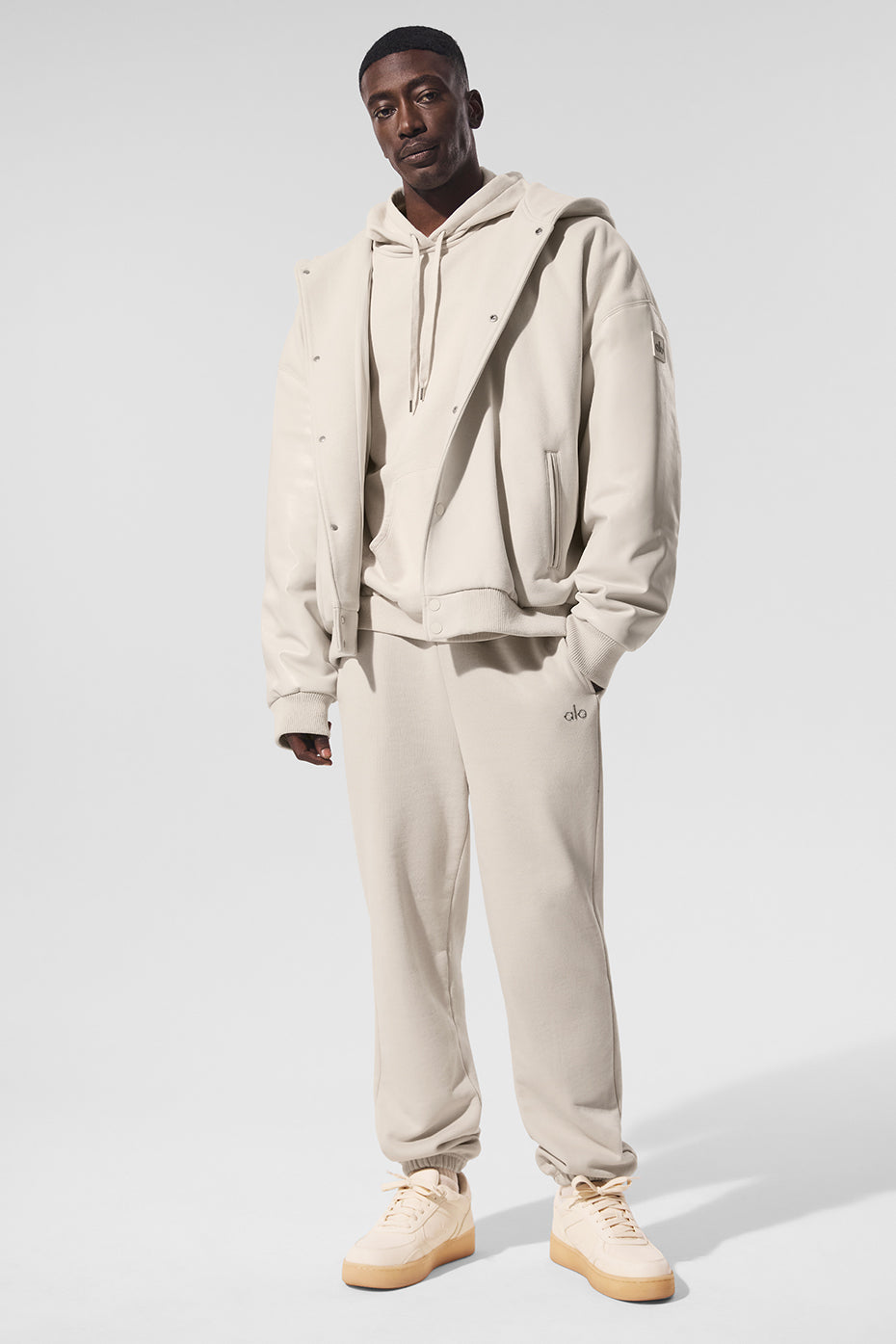 Model wearing Urban Edge Hooded Bomber Jacket, demonstrating its stylish fit.