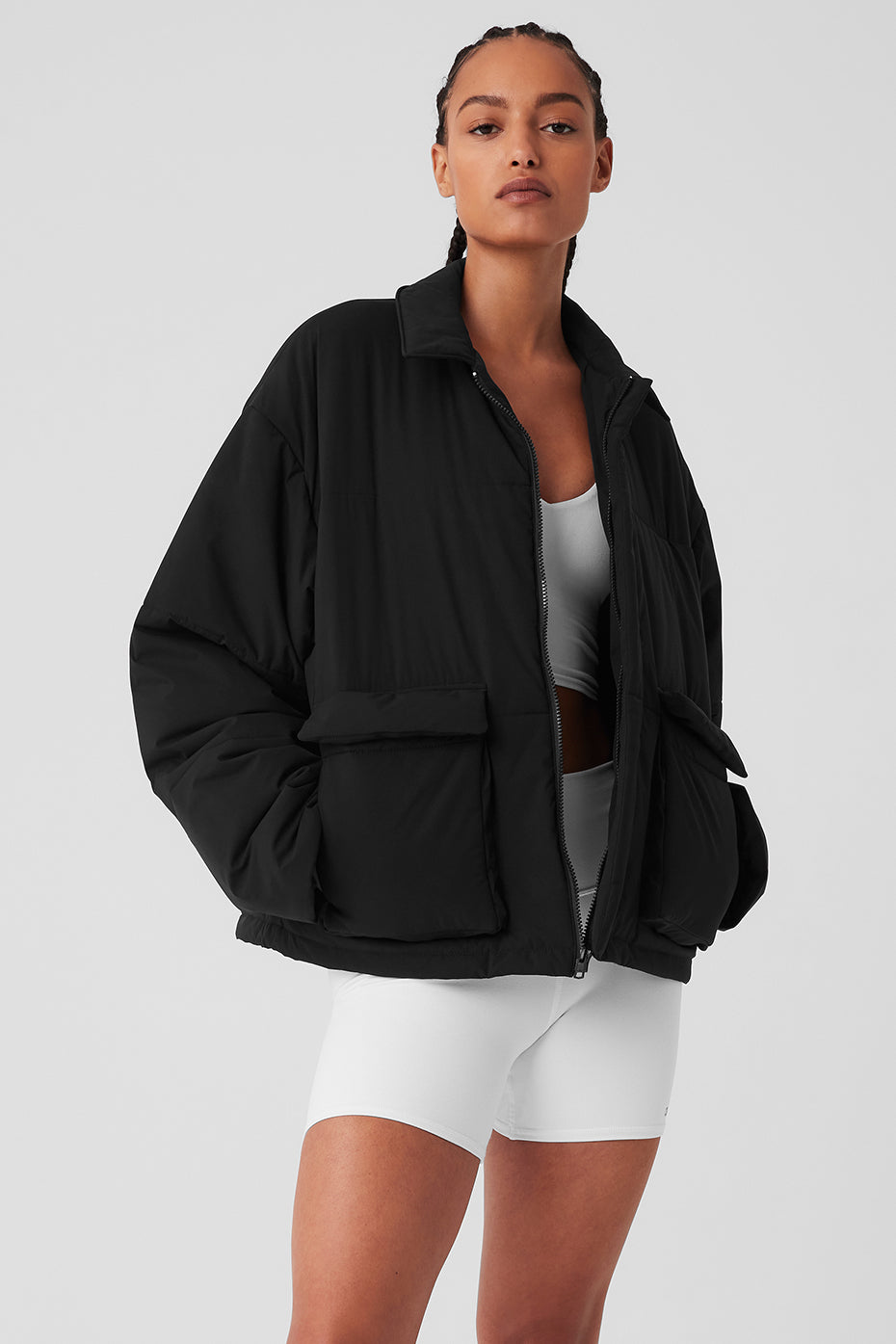 Front view of men's utility jacket featuring flap pockets and zip collar