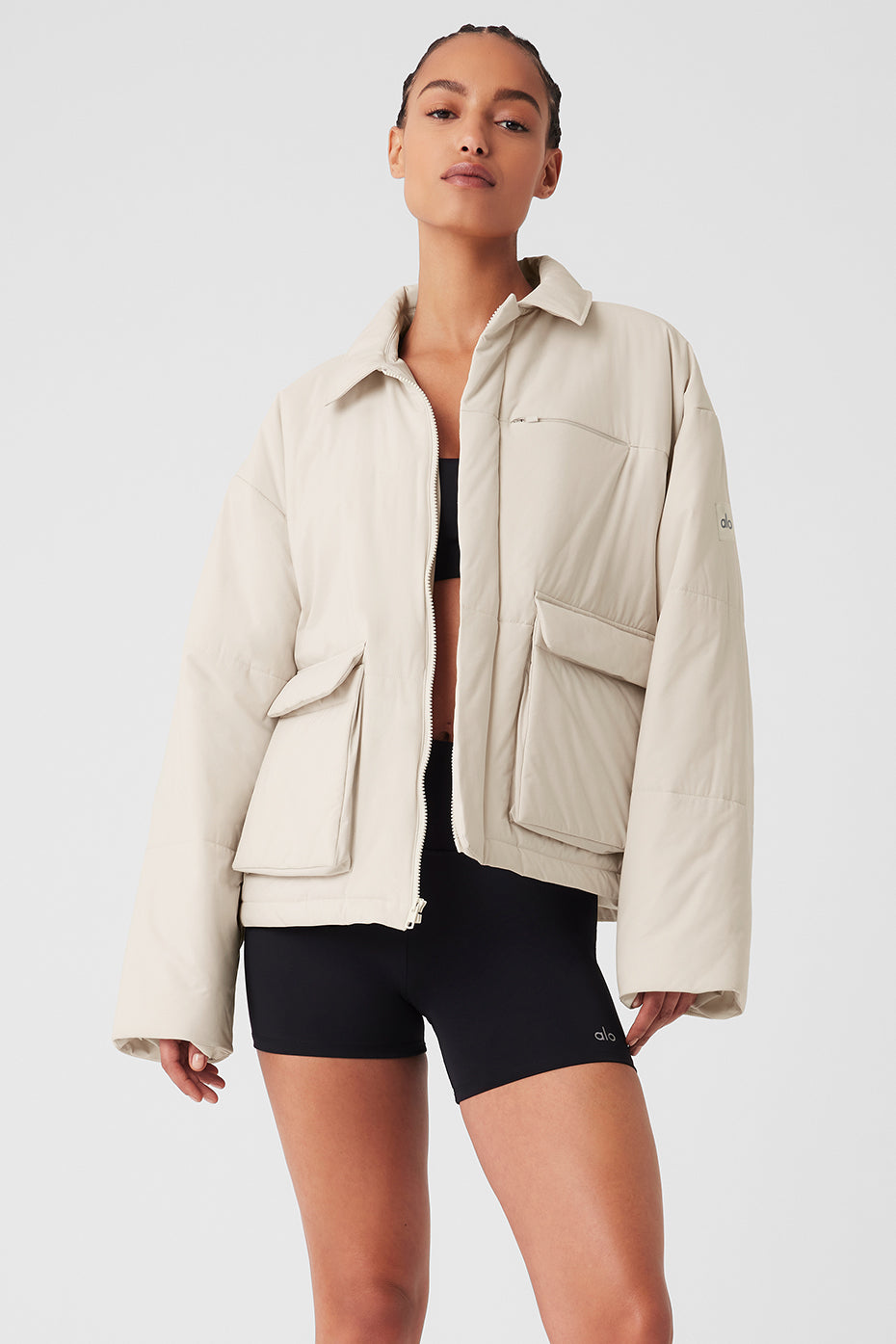 Close-up of the Voyage Utility Jacket’s quilted texture and zippered pocket