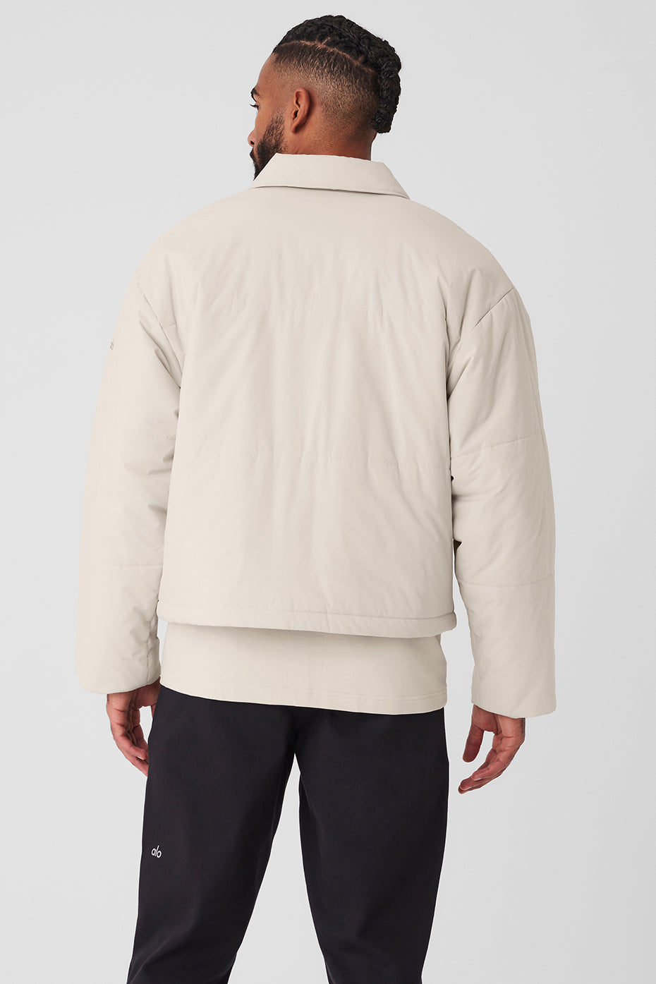 Side view of the womens utility jacket, highlighting the oversized pockets and collar.