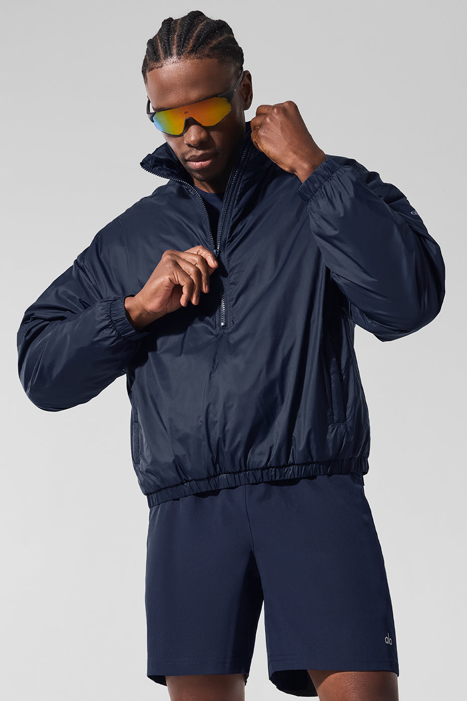 Front view of the navy lightweight half zip pullover jacket.