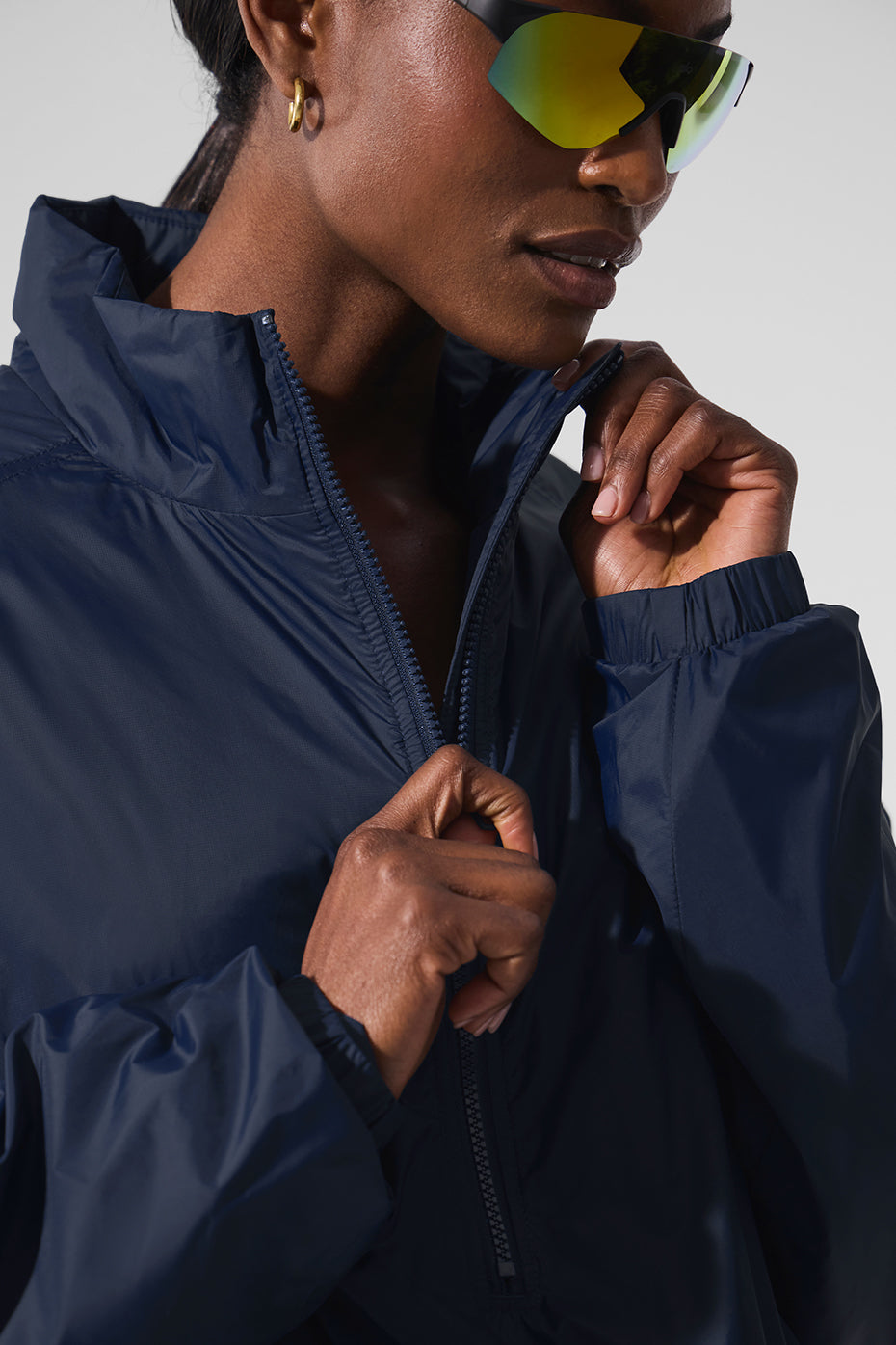 Close-up of the Latitude running jackets water-repellent fabric texture.