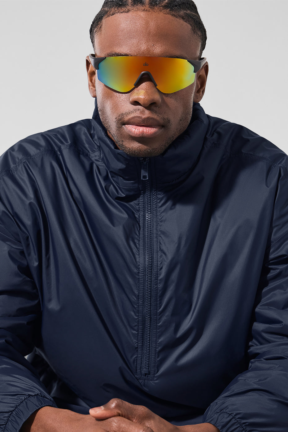 Front view of the navy lightweight half zip pullover jacket.