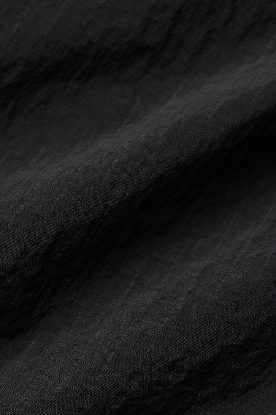 Back view highlighting the bungee hem of the track jacket.