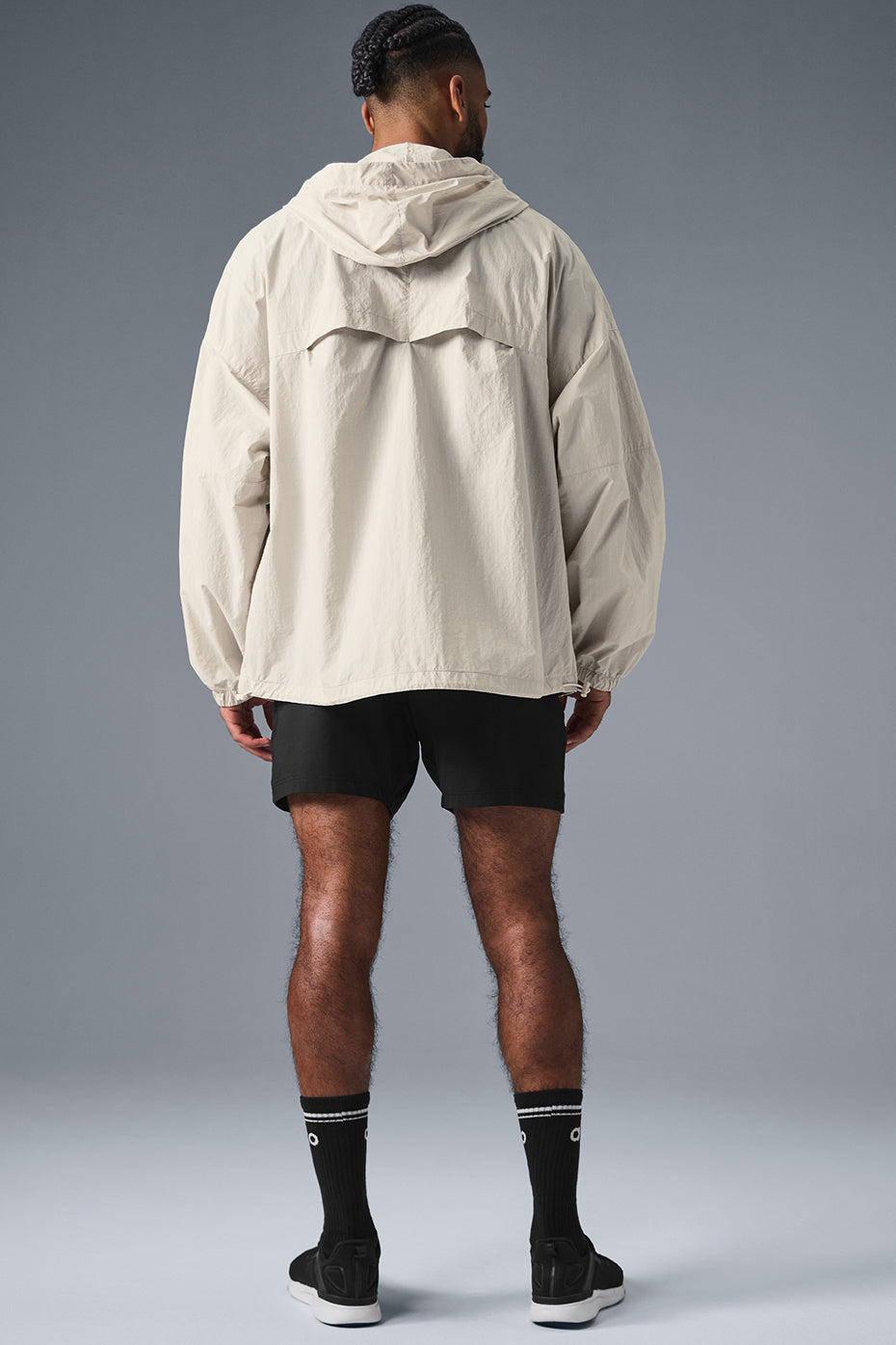 Men wearing the lightweight track jacket during training in cool weather