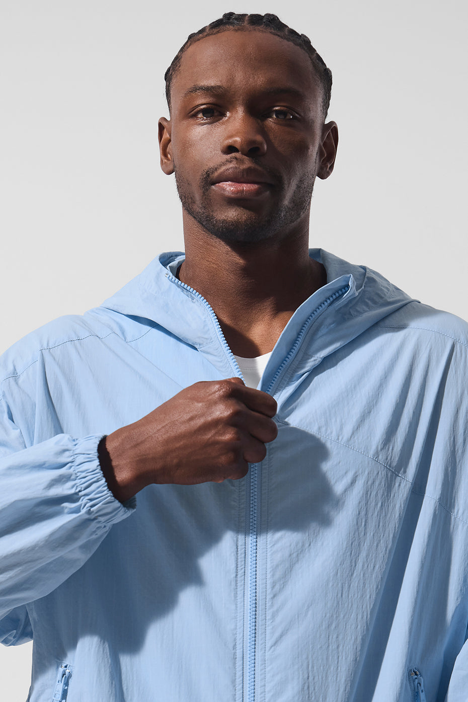 Athlete wearing track jacket during urban run