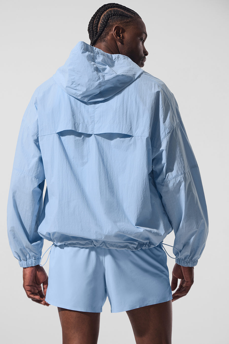 Seashell blue mens track jacket laid flat showing ripstop texture