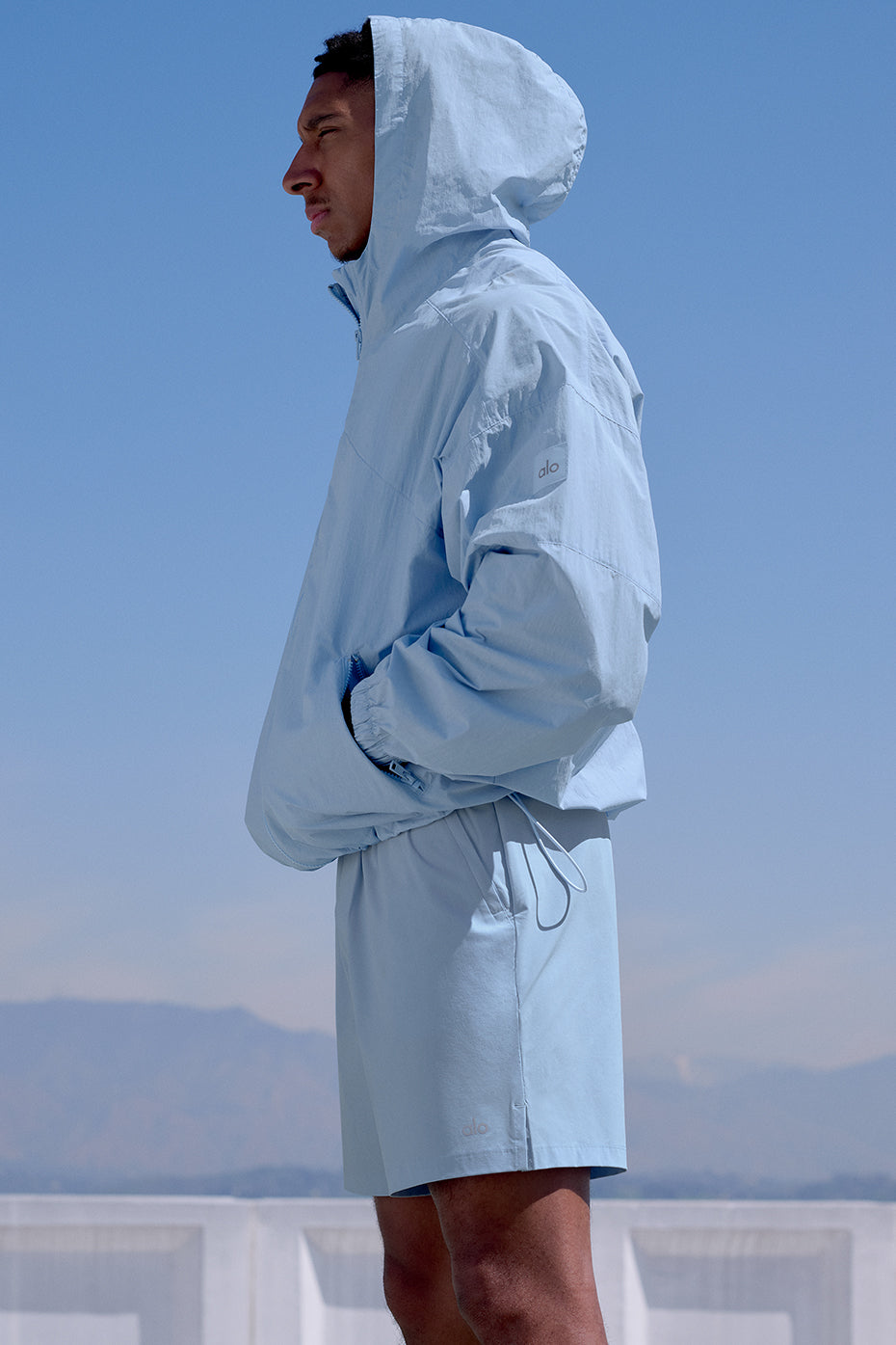 Seashell blue mens track jacket laid flat showing ripstop texture