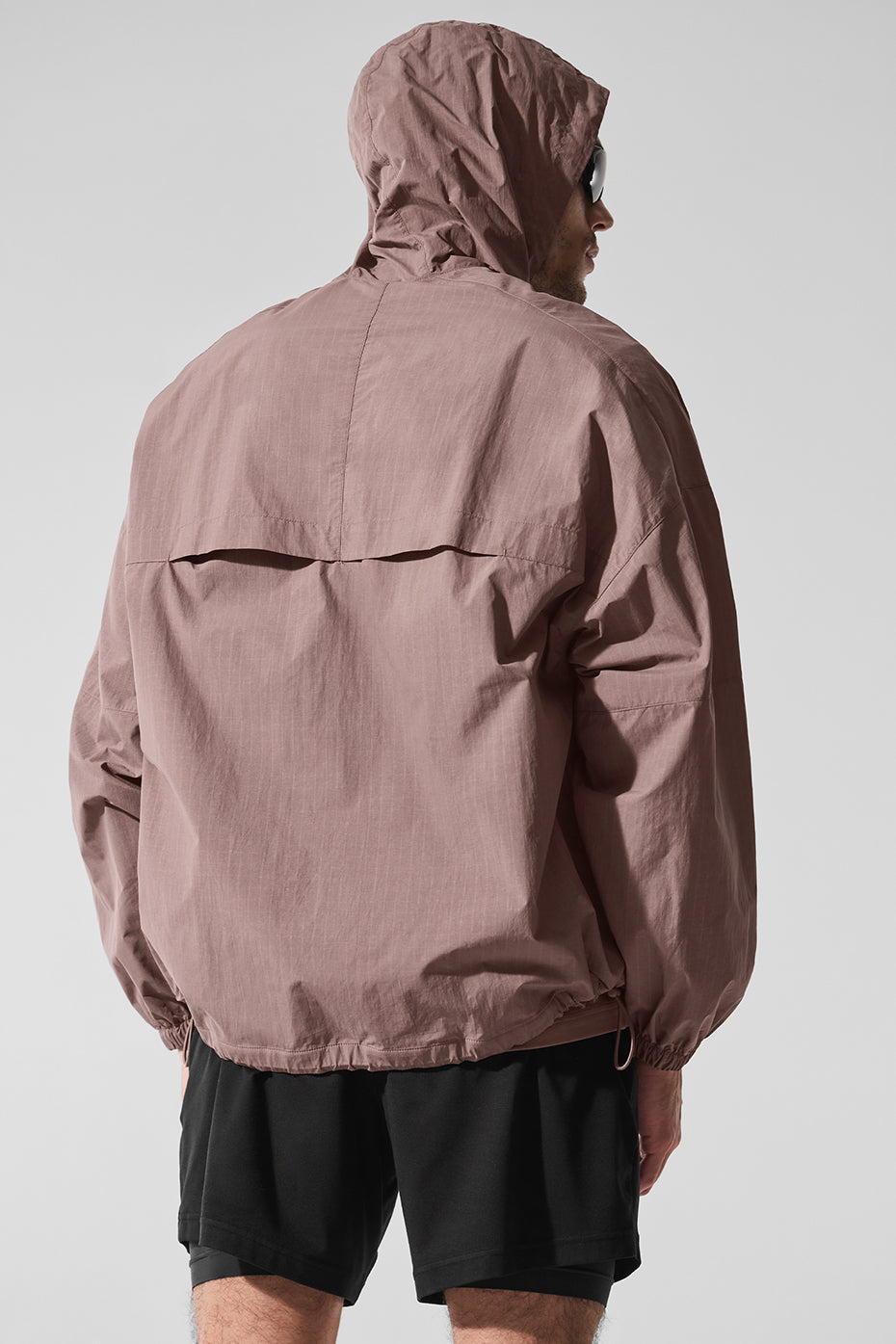 Side view showcasing the structured hood of the Vantage track jacket.