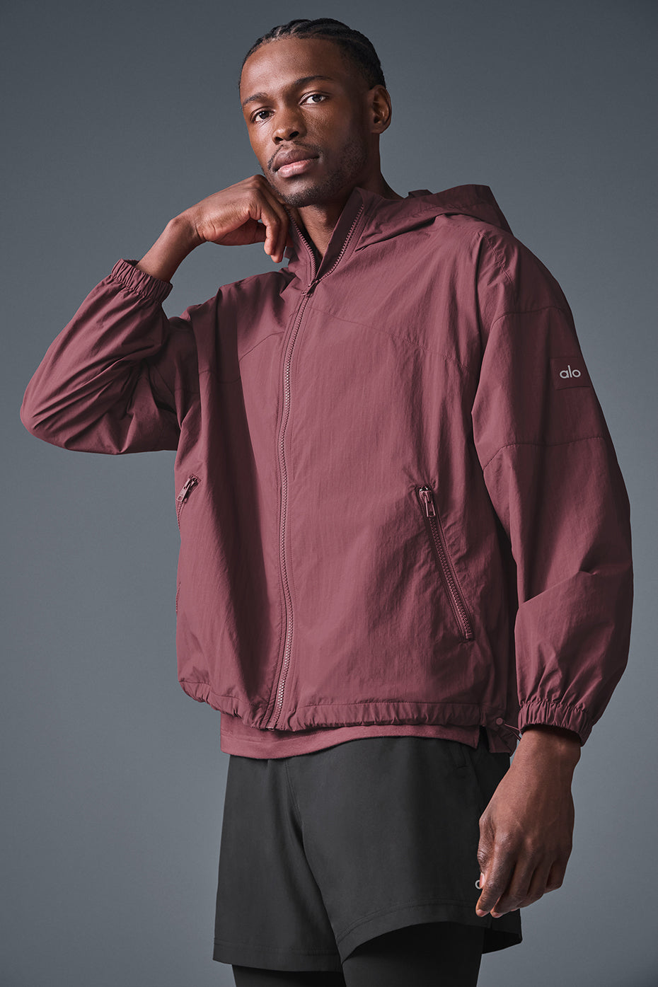 Front view of burgundy truffle track jacket for running in cool weather