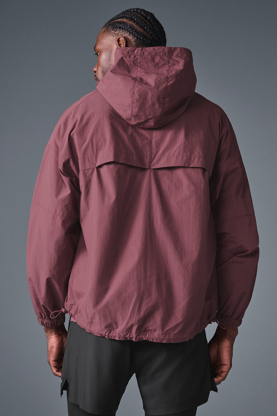 Side angle highlighting cuffed sleeves and longer back hem on lightweight jacket