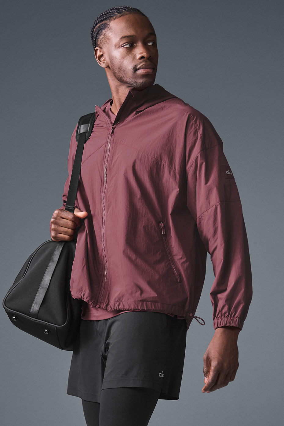 Jacket laid flat showing structured hood and nylon ripstop material