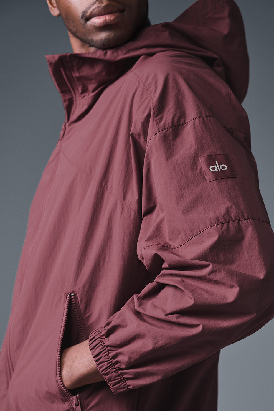 Front view of burgundy truffle track jacket for running in cool weather