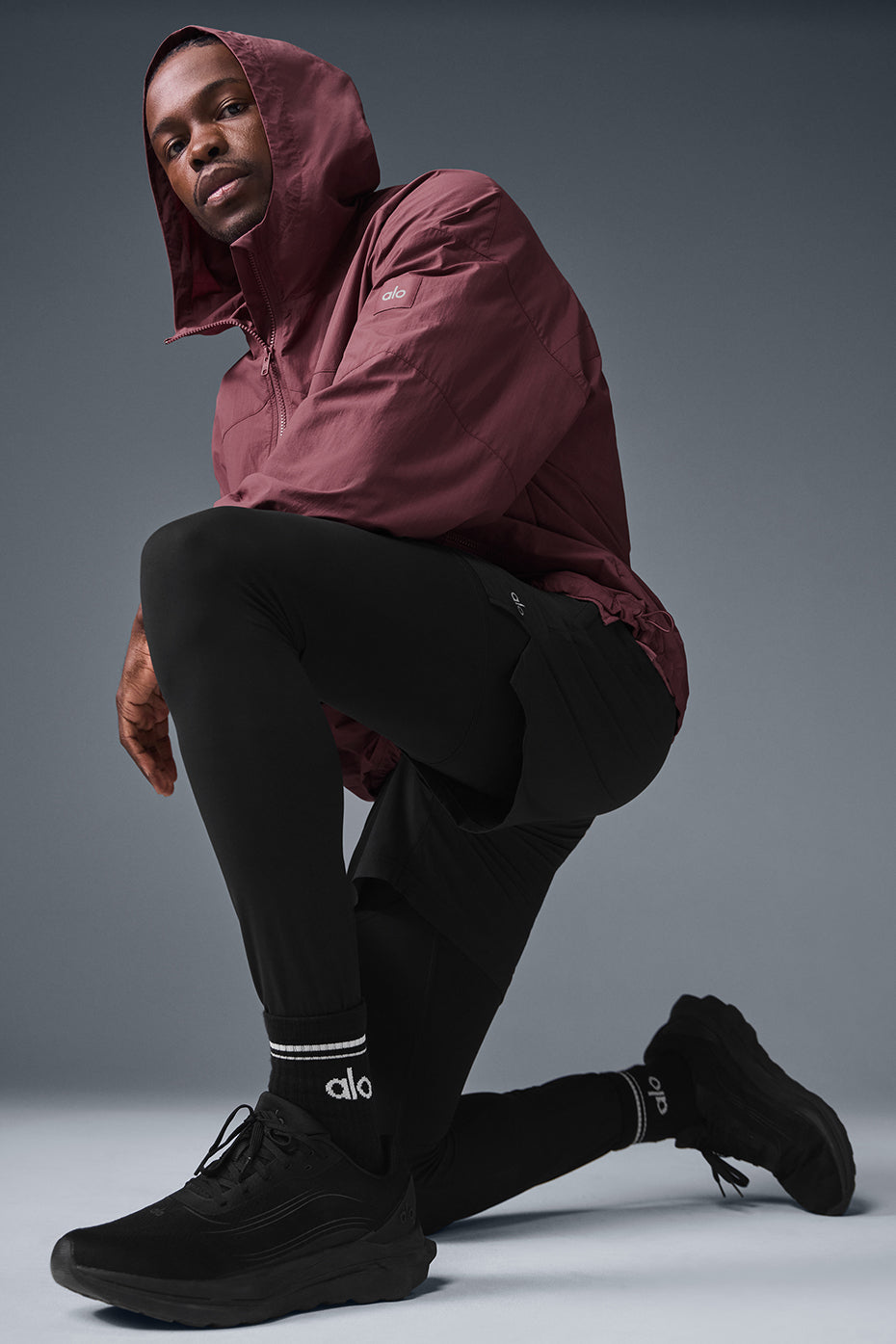 Side angle highlighting cuffed sleeves and longer back hem on lightweight jacket