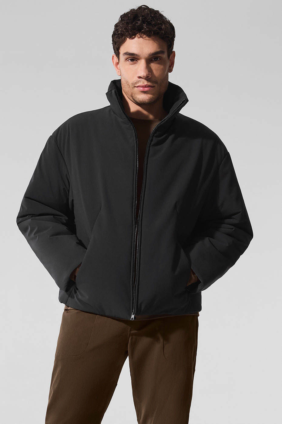 Front view of the sleek bomber jacket showcasing its stylish collar and pockets.