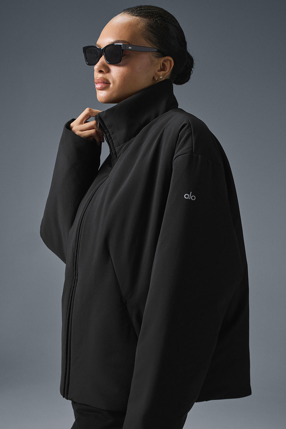 Model wearing the jacket in a city setting, showcasing its versatile fit.