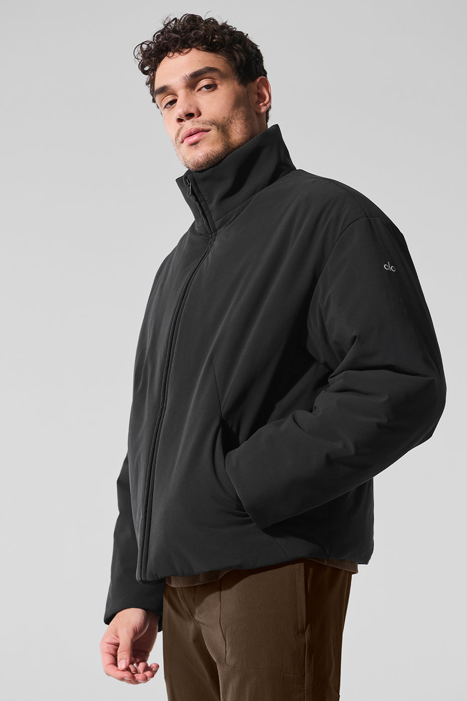 Close-up of the plush filling and soft lining of the bomber jacket.