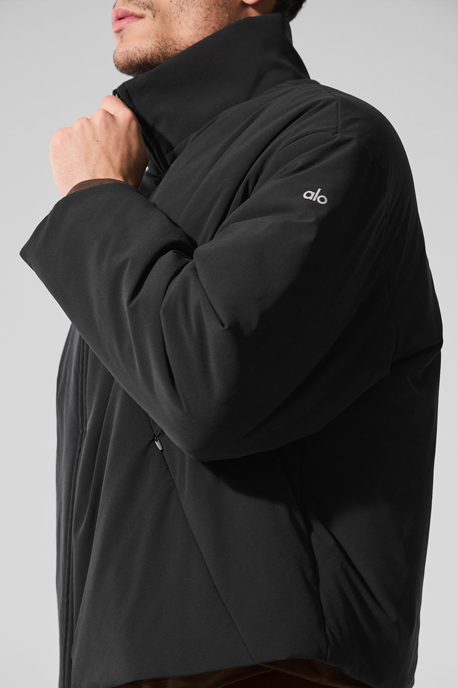 Front view of the sleek bomber jacket showcasing its stylish collar and pockets.