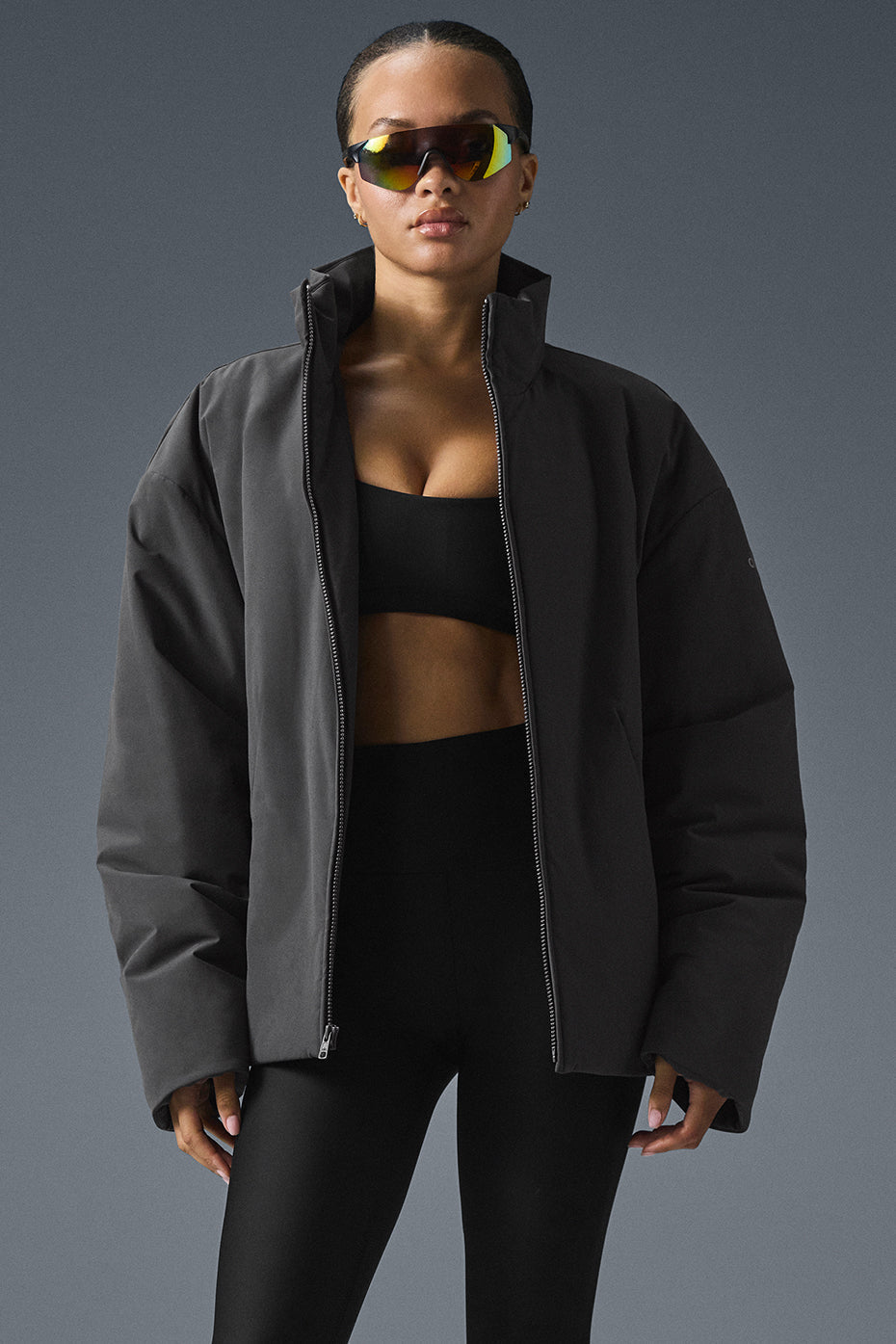 Stylish lightweight down jacket on a model in a city setting.